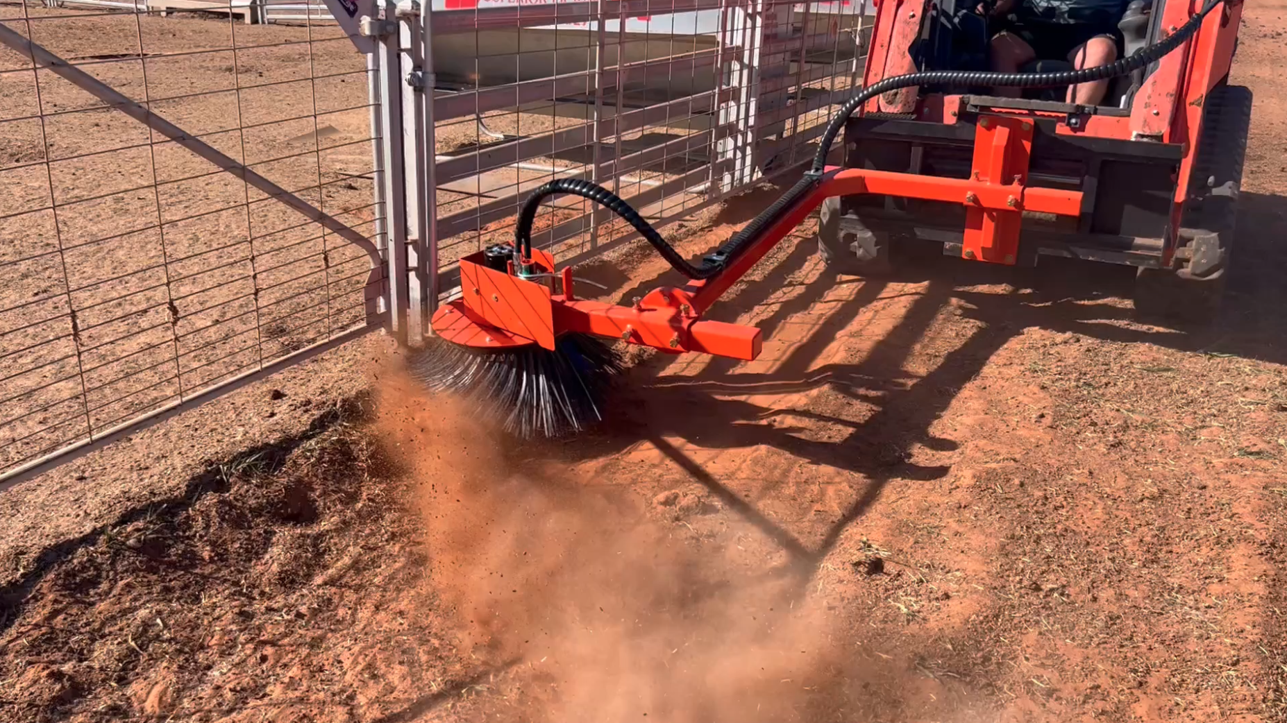 Stock feed lot fence sweeper