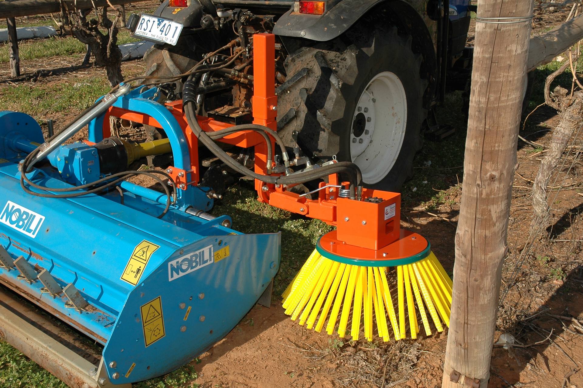 Sweeper-mounted-with-mulcher-with-a-hydraulic-tilt-cylinder-